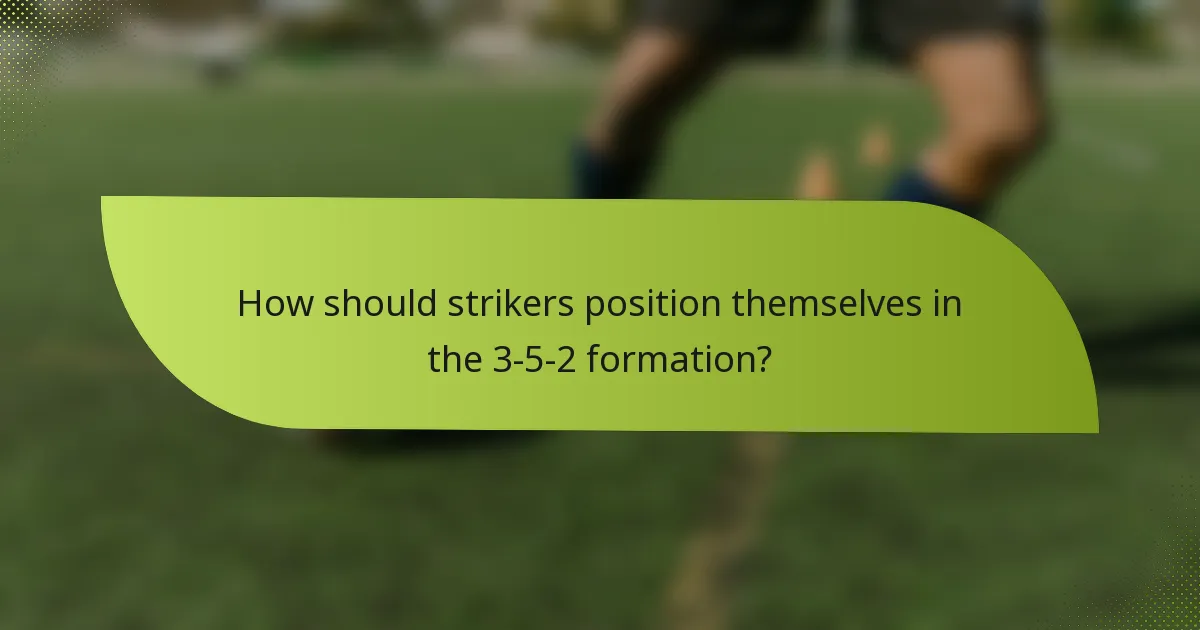 How should strikers position themselves in the 3-5-2 formation?